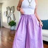 Thin, lightweight washed lavender cotton ultra wide leg pants with pleated front elastic waist.