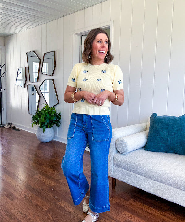 Stretchy medium wash utility style cropped denim with a high rise.