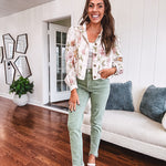 Cream short jacket with puff sleeves, oversized buttons down the front with vintage pink and green florals throughout.