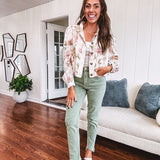 Cream short jacket with puff sleeves, oversized buttons down the front with vintage pink and green florals throughout.