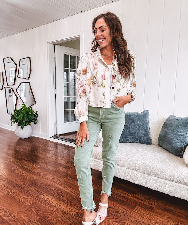Cream short jacket with puff sleeves, oversized buttons down the front with vintage pink and green florals throughout.