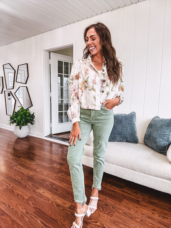 Cream short jacket with puff sleeves, oversized buttons down the front with vintage pink and green florals throughout.