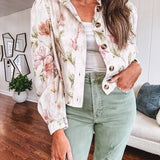 Cream short jacket with puff sleeves, oversized buttons down the front with vintage pink and green florals throughout.