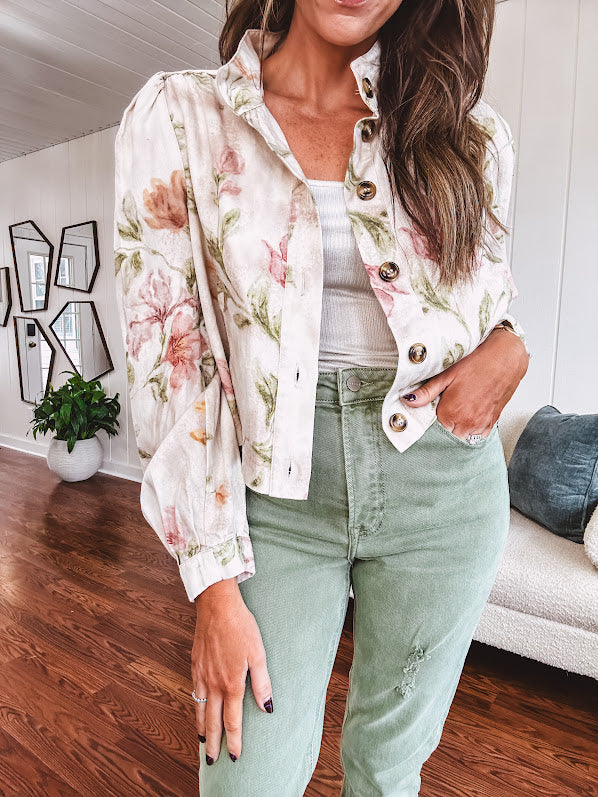 Cream short jacket with puff sleeves, oversized buttons down the front with vintage pink and green florals throughout.