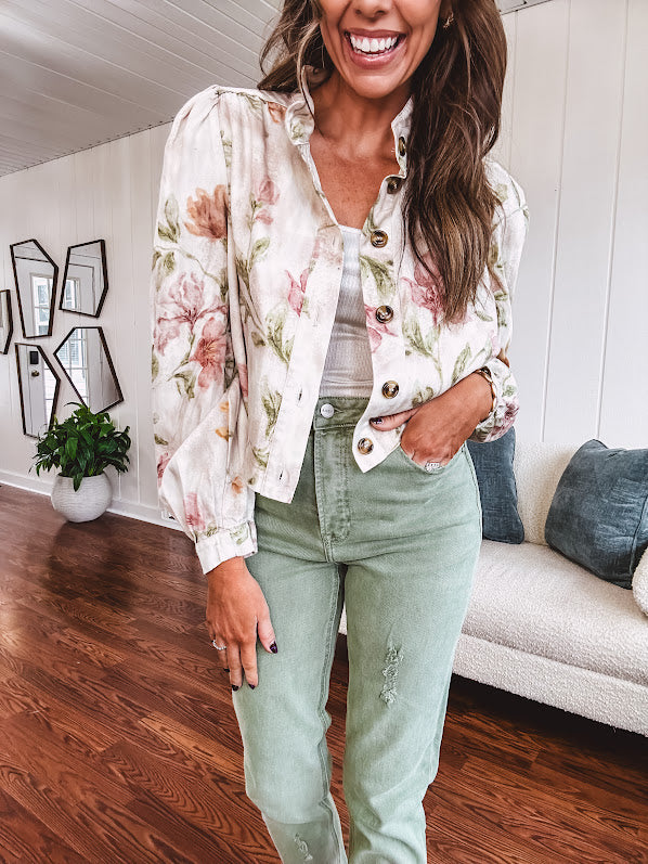 Cream short jacket with puff sleeves, oversized buttons down the front with vintage pink and green florals throughout.