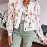 Cream short jacket with puff sleeves, oversized buttons down the front with vintage pink and green florals throughout.