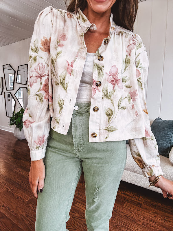 Cream short jacket with puff sleeves, oversized buttons down the front with vintage pink and green florals throughout.