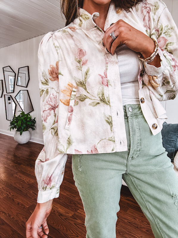 Cream short jacket with puff sleeves, oversized buttons down the front with vintage pink and green florals throughout.
