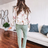 Cream short jacket with puff sleeves, oversized buttons down the front with vintage pink and green florals throughout.