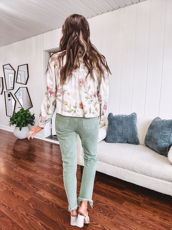 Cream short jacket with puff sleeves, oversized buttons down the front with vintage pink and green florals throughout.