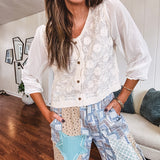 Thin, lightweight wide leg pants with elastic back button and zipper closure, teal, blue and taupe patchwork and mixed fabrics throughout with lace and star patches, pockets and raw hem.