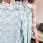 Sheer mock neck long sleeved mesh with matching floral design throughout.
