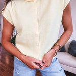 Soft, lightweight and thin cap sleeved button front sweater.