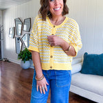 Short sleeved yellow and cream textured weave button down sweater.