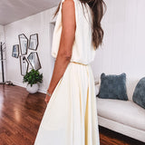 Soft, butter yellow sleeveless top with bubble hem, hook and eye closure at the neck with matching fully lined skirt with flat front waist and pleating with elastic back at the waist, flowy skirt.