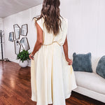 Soft, butter yellow sleeveless top with bubble hem, hook and eye closure at the neck with matching fully lined skirt with flat front waist and pleating with elastic back at the waist, flowy skirt.