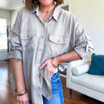 Lightweight Tencel button down top in taupe with adjustable sleeves and front pockets.