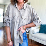 Lightweight Tencel button down top in taupe with adjustable sleeves and front pockets.