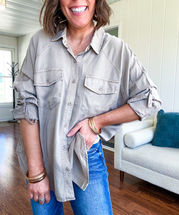 Lightweight Tencel button down top in taupe with adjustable sleeves and front pockets.