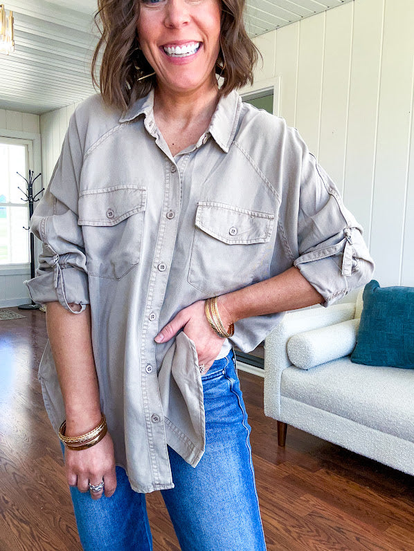 Lightweight Tencel button down top in taupe with adjustable sleeves and front pockets.