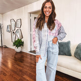 Light wash barrel jeans with extra large pockets and flared, raw hems.