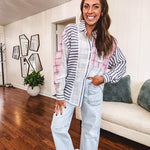 Lightweight, oversized long sleeved button down with pink plaid, light blue plaid and dark blue and white stripes mixed throughout.