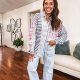 Lightweight, oversized long sleeved button down with pink plaid, light blue plaid and dark blue and white stripes mixed throughout.