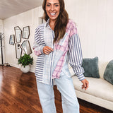 Lightweight, oversized long sleeved button down with pink plaid, light blue plaid and dark blue and white stripes mixed throughout.