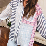 Lightweight, oversized long sleeved button down with pink plaid, light blue plaid and dark blue and white stripes mixed throughout.