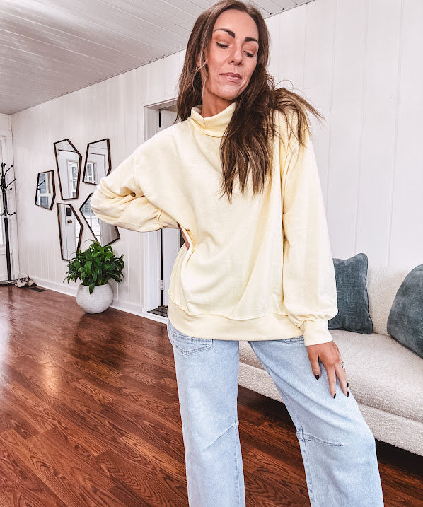 Thin, lightweight soft long sleeved pullover with mock neck and exposed seams, oversized.