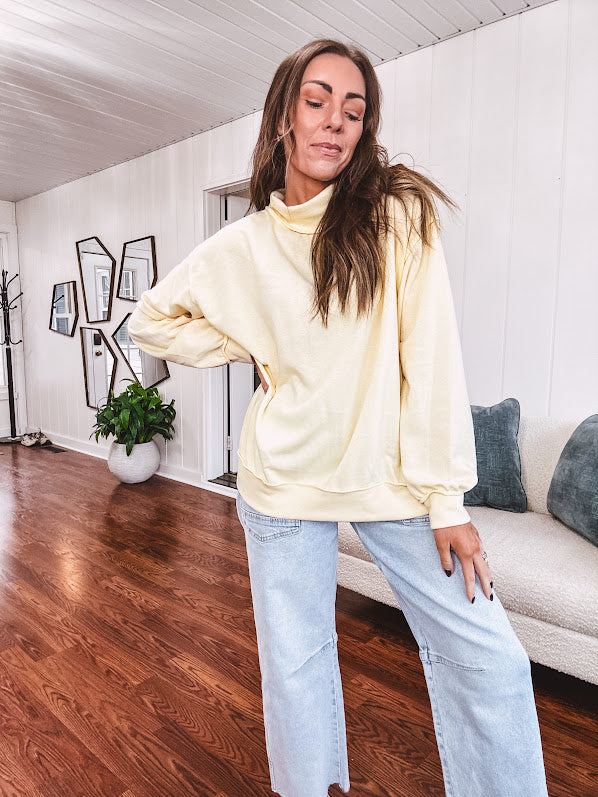 Thin, lightweight soft long sleeved pullover with mock neck and exposed seams, oversized.