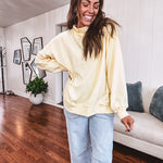 Thin, lightweight soft long sleeved pullover with mock neck and exposed seams, oversized.