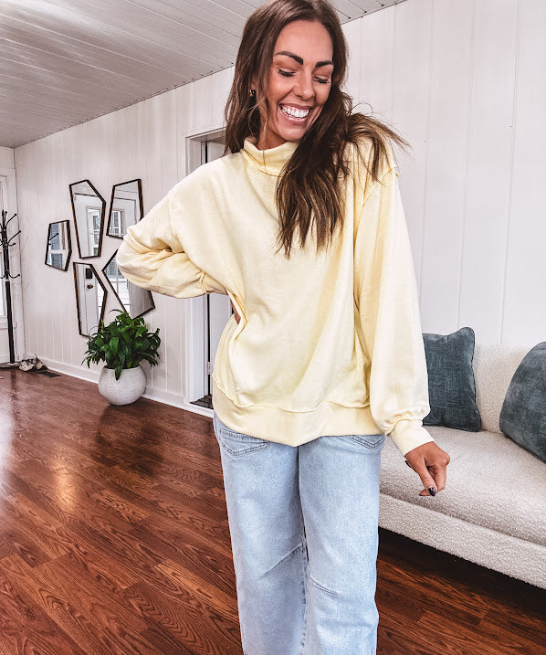 Thin, lightweight soft long sleeved pullover with mock neck and exposed seams, oversized.