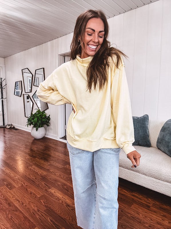 Thin, lightweight soft long sleeved pullover with mock neck and exposed seams, oversized.