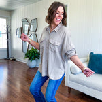Lightweight Tencel button down top in taupe with adjustable sleeves and front pockets.