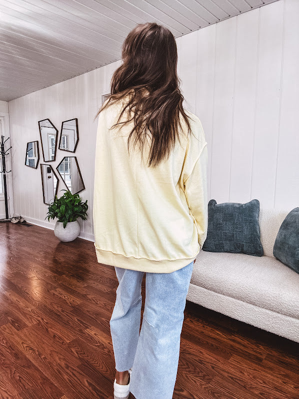 Thin, lightweight soft long sleeved pullover with mock neck and exposed seams, oversized.
