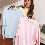 Thin, lightweight soft long sleeved pullover with mock neck and exposed seams, oversized.