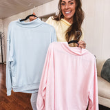 Thin, lightweight soft long sleeved pullover with mock neck and exposed seams, oversized.