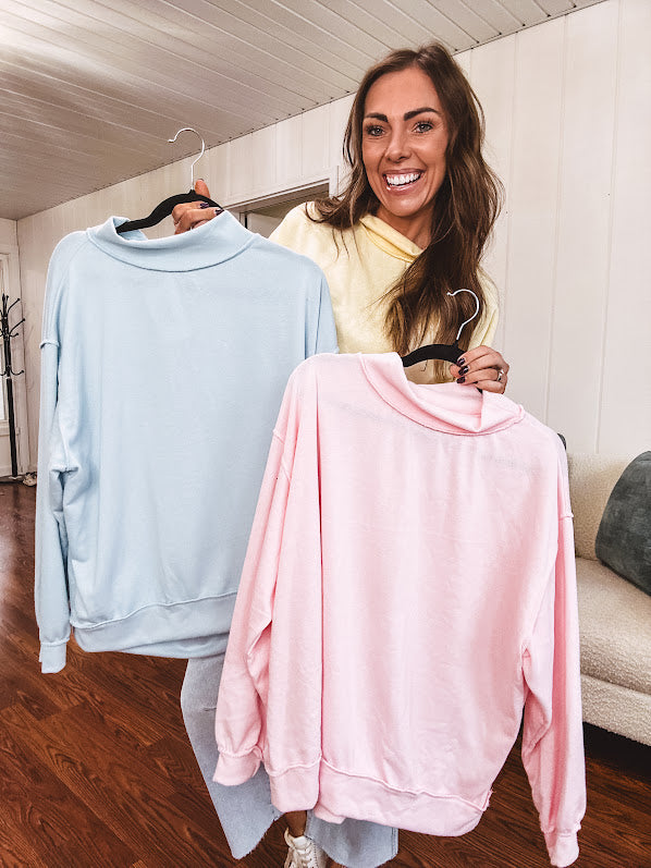 Thin, lightweight soft long sleeved pullover with mock neck and exposed seams, oversized.