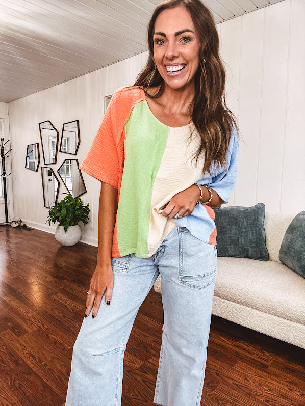 Gauze colorblock V neck tee with light blue, cream, sage and coral stripes.