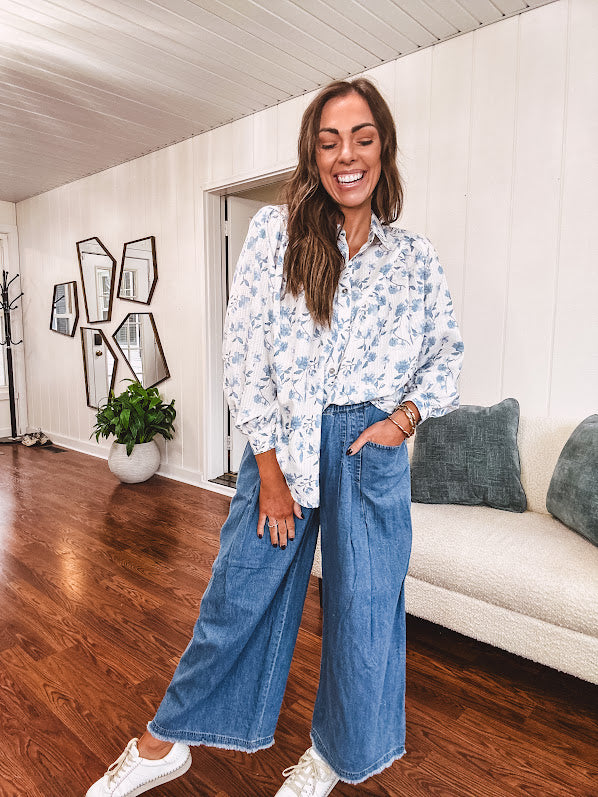 Medium wash chambray wide leg pants with pintuck detail, elastic waist and raw hems.