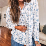 Long sleeved white button down with window pane pattern and blue watercolor florals throughout.