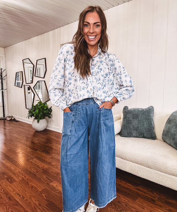Medium wash chambray wide leg pants with pintuck detail, elastic waist and raw hems.