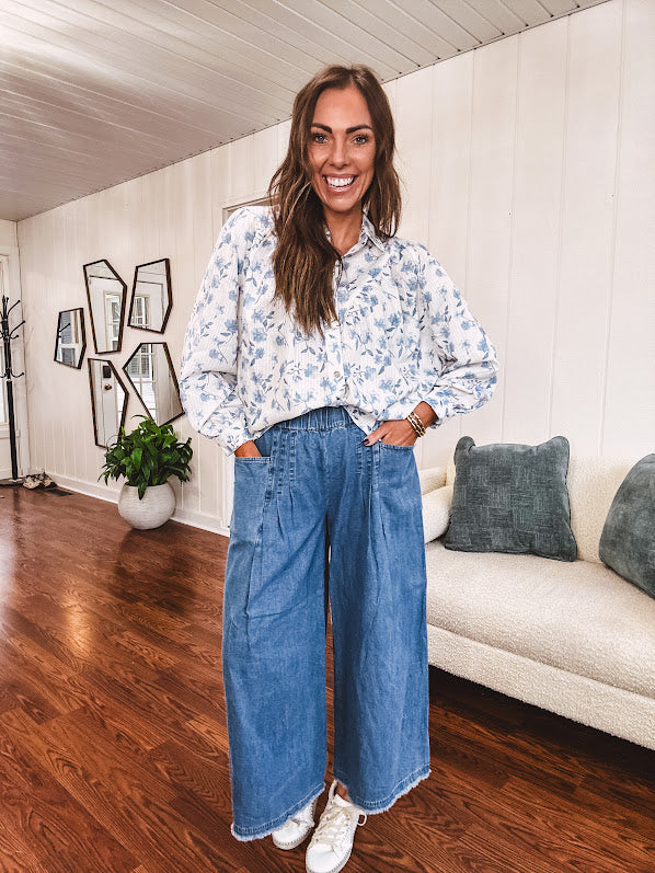 Medium wash chambray wide leg pants with pintuck detail, elastic waist and raw hems.