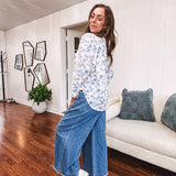 Medium wash chambray wide leg pants with pintuck detail, elastic waist and raw hems.