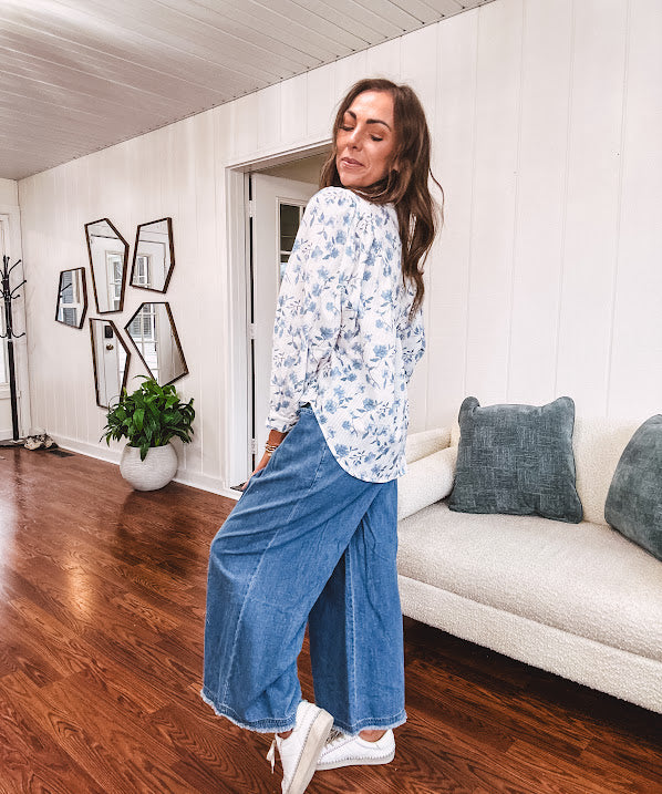 Medium wash chambray wide leg pants with pintuck detail, elastic waist and raw hems.