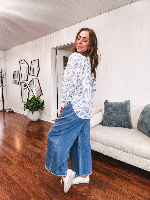 Medium wash chambray wide leg pants with pintuck detail, elastic waist and raw hems.
