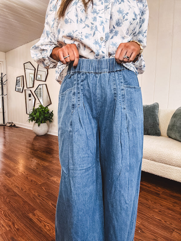 Medium wash chambray wide leg pants with pintuck detail, elastic waist and raw hems.