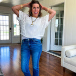 Open weave short sleeved waist length sweater available in many colors.