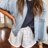 3/4 sleeve light wash chambray button down shirt with front pocket.